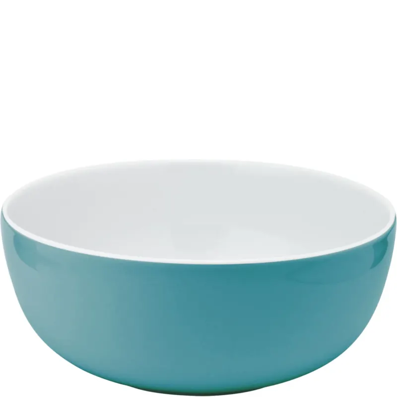 Eine große, runde Schüssel mit einem glatten, türkisfarbenen Äußeren und einem weißen inneren Fach. Die Schüssel hat eine einfache, moderne Form und eignet sich gut für Salate, Snacks oder als Servierschüssel. Der Stil ist funktional und dekorativ, ideal für den täglichen Gebrauch oder besondere Anlässe.