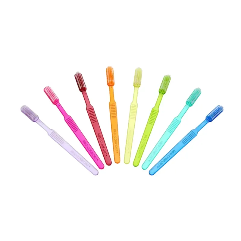 Sieben leuchtende AMPri MED-COMFORT Dental PS Einmal-Zahnbürsten mit Zahnpasta sind ordentlich in einer Reihe angeordnet. Von links nach rechts sind die Farben lila, rosa, rot, orange, gelb, grün und blau. Jede hat ein ähnliches Design mit weichen Borsten, die sich perfekt für die Zahnpflege unterwegs eignen.