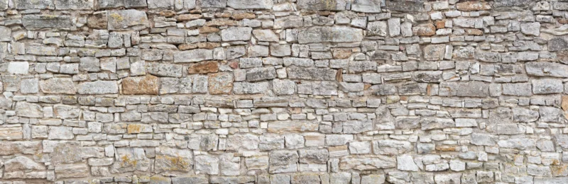 Küchenrückwand-Gräuliche alte Mauer aus groben Steinen